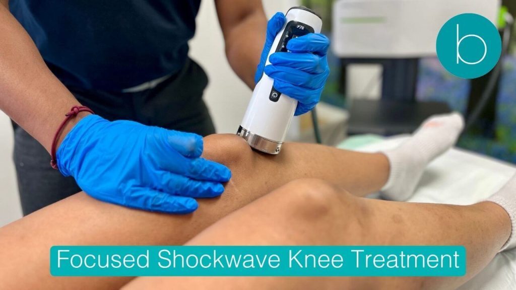 Focused shockwave therapy being applied to a patient's knee for patellar tendonitis treatment at Bodytonic Clinic.