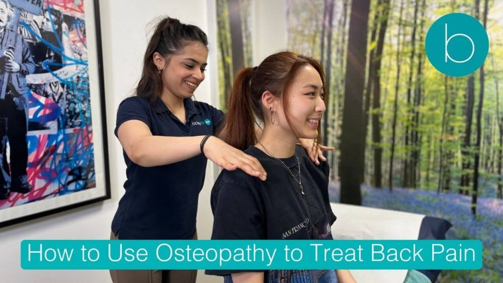 Osteopath treating lower back pain in London clinic using manual therapy and Focused Shockwave.