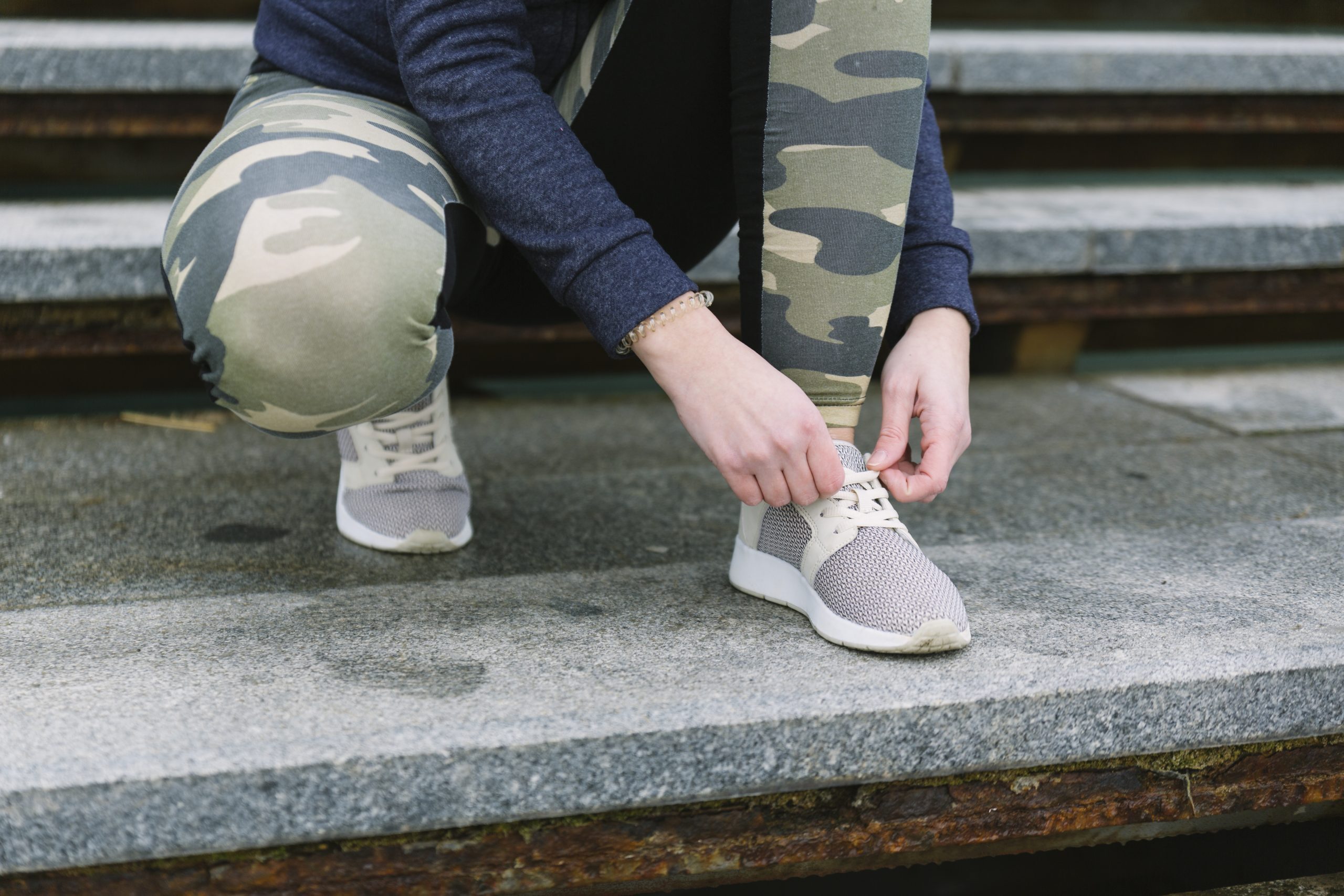 low section female jogger tying shoelace 1 scaled How to Treat Ankle Pain without Medication