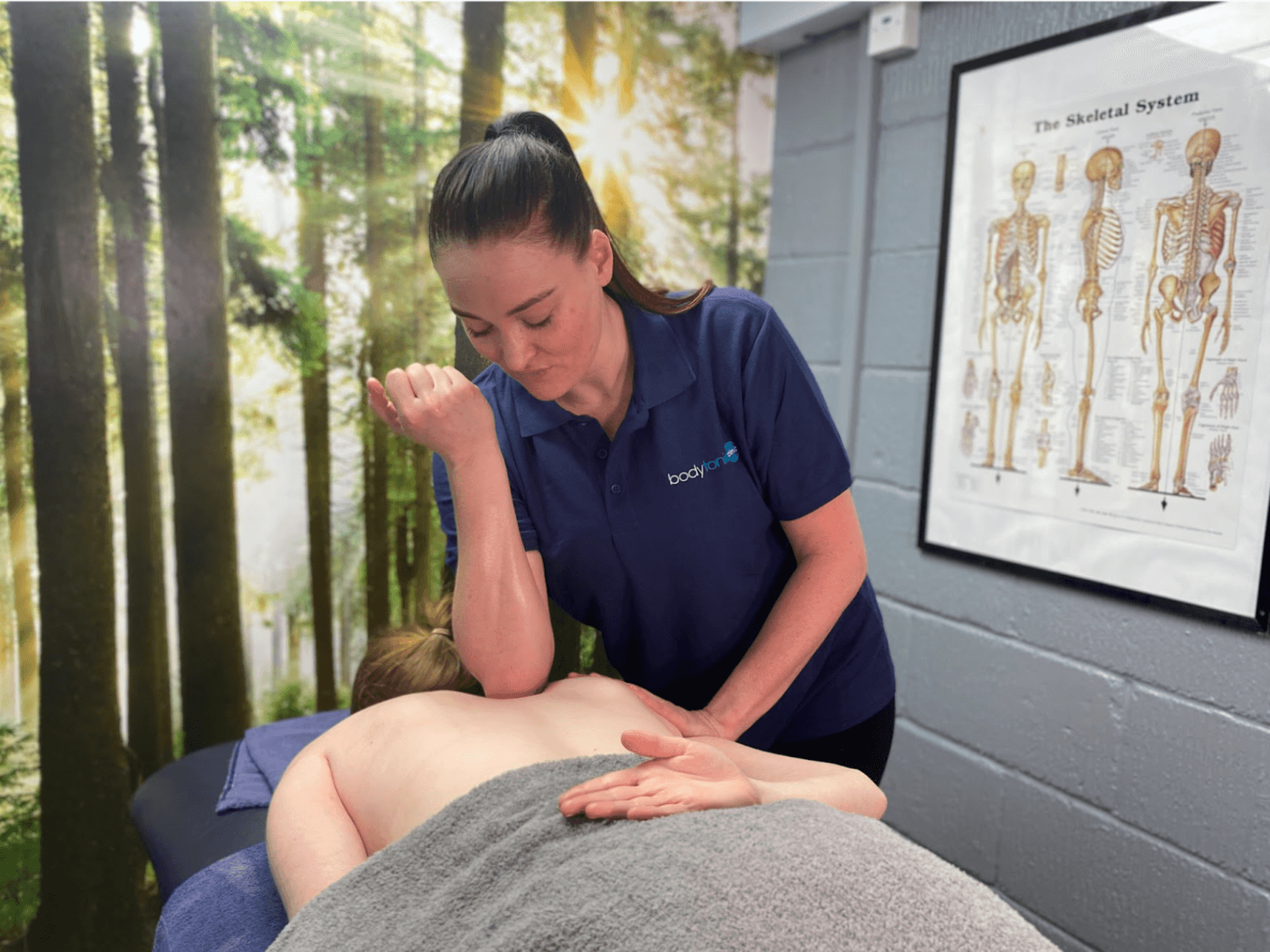 Patient receiving massage treatment at Bodytonic Clinic in London, Canada Water SE16 and Stratford E15 E20